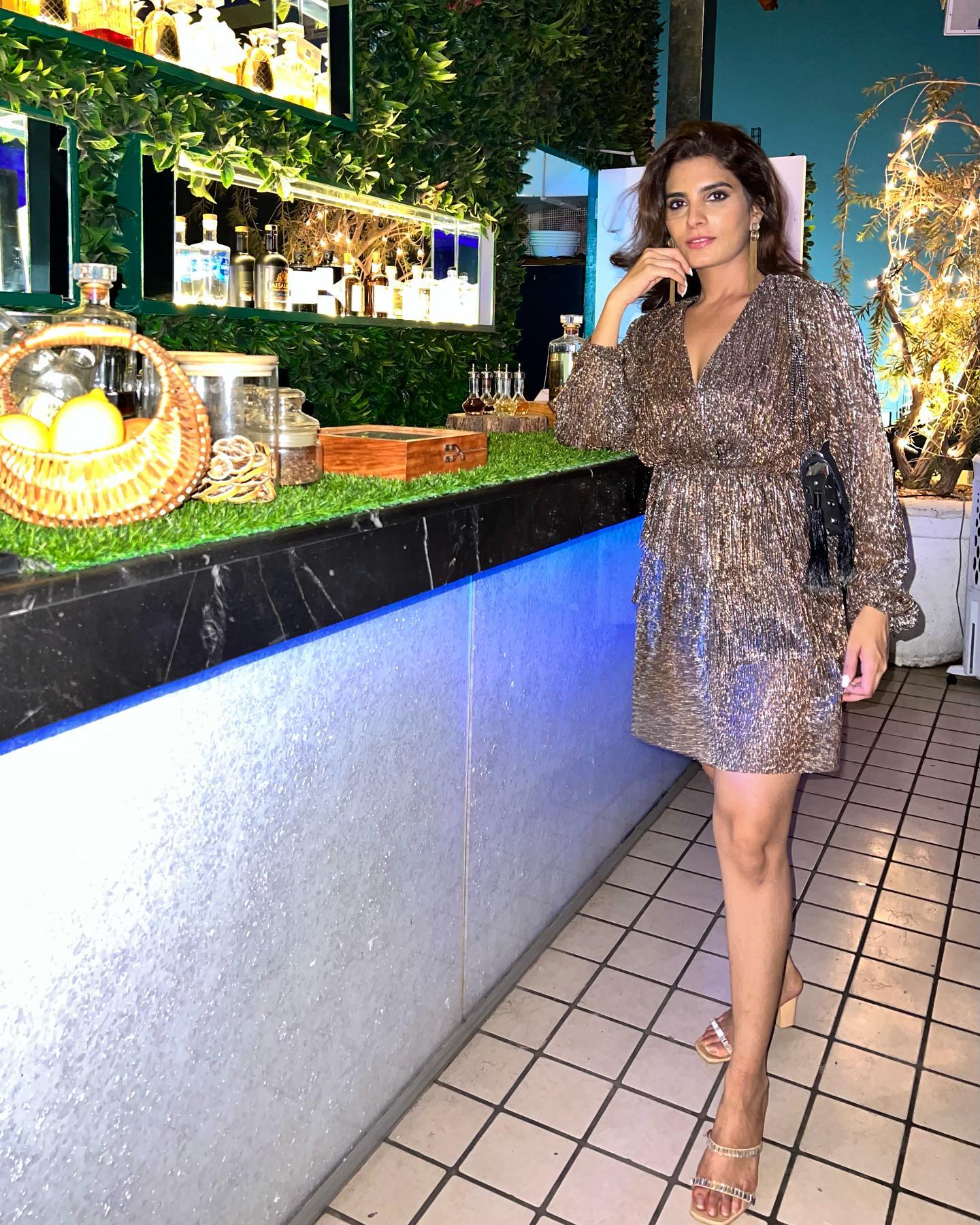 Krishna Talesara in our Divine Plunge Uptown Mini Dress - Bronzite