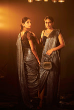 Load image into Gallery viewer, Saia metallic slit saree with an embellished pearl blouse will definitely make you look sassy and elegant in an event.  Tailored to perfection in a metallic fabric, the saree features a slit from the waist level and has an attached palla which creates a great fall.  It comes with a pearl embellished blouse with dori attachments on the back.