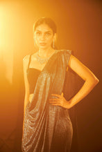 Load image into Gallery viewer, Saia metallic slit saree with an embellished pearl blouse will definitely make you look sassy and elegant in an event.  Tailored to perfection in a metallic fabric, the saree features a slit from the waist level and has an attached palla which creates a great fall.  It comes with a pearl embellished blouse with dori attachments on the back.